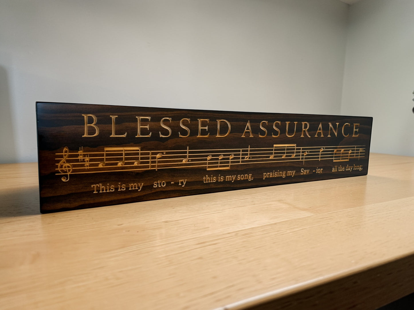 Carved Blessed Assurance hymn wood sign with musical notes and lyrics in Kona stain, 7 x 36 Christian wall decor by CARVEDN